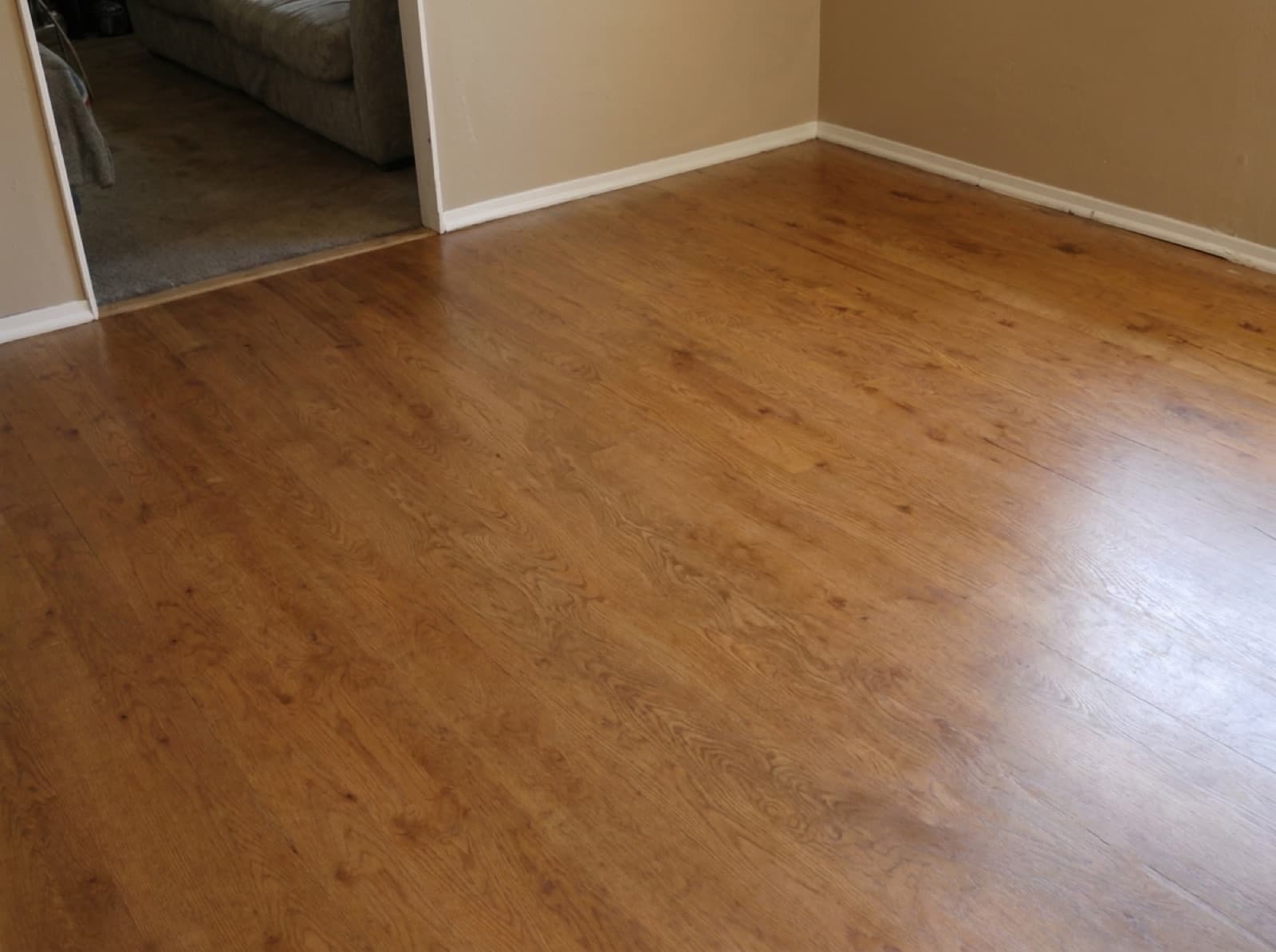 Same living room after sanding and refinishing in a warm satin finish